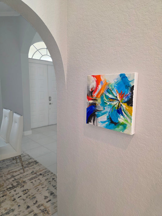 Colorful abstract painting on a wall in a modern interior setting