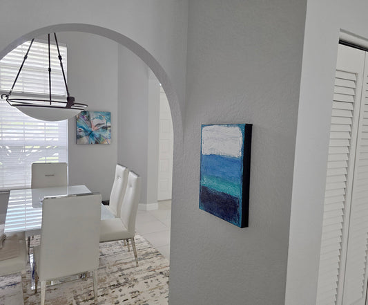 Modern interior with a dining area and abstract wall art